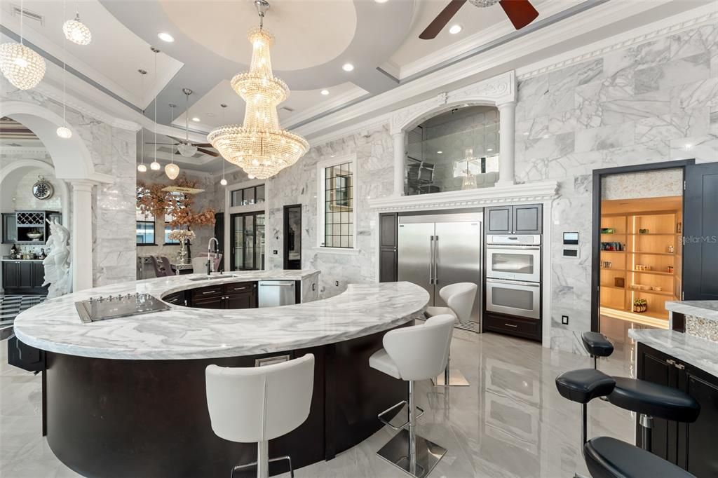 Chandelier, Interior, Kitchen, Marble, Marble Walls, Pendant Lights, Recessed Lighting, Stainless Steel Appliances