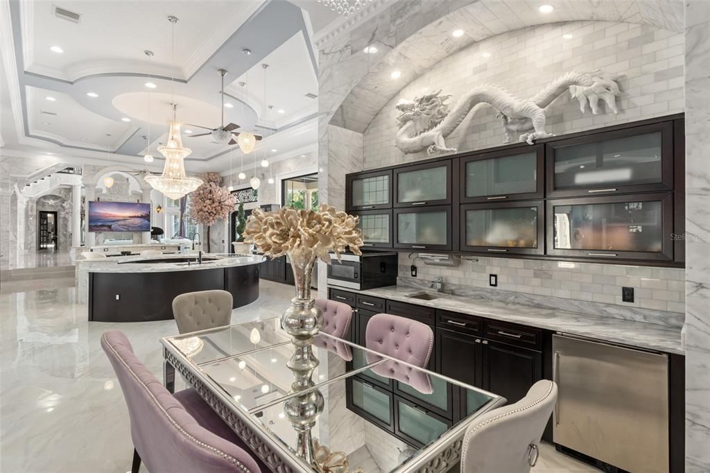 Chandelier, Dining room, Interior, Kitchen, Marble, Marble Walls, Pendant Lights, Recessed Lighting, Stainless Steel Appliances