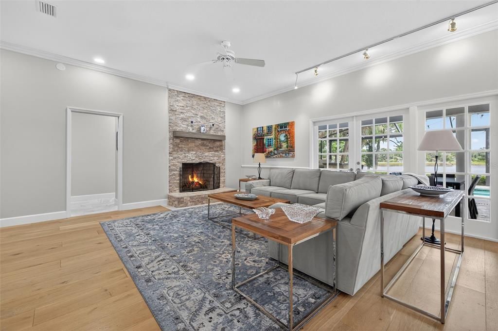 Fireplace, Interior, Living room, Recessed Lighting, Stone Walls, Wood Texture Flooring