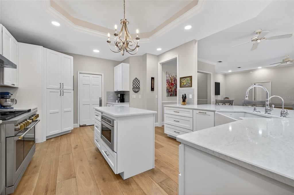 Chandelier, Interior, Kitchen, Recessed Lighting, Stainless Steel Appliances, Wood Texture Flooring