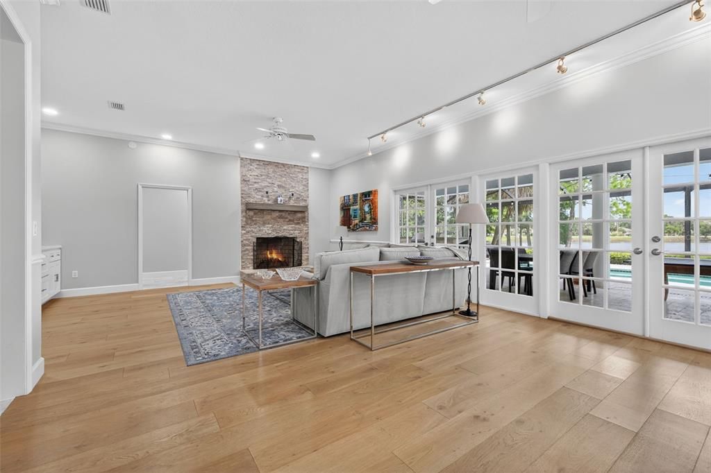 Fireplace, Interior, Living room, Recessed Lighting, Stone Walls, Wood Texture Flooring