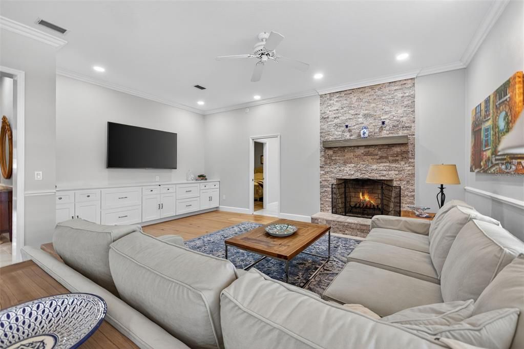 Fireplace, Interior, Living room, Recessed Lighting, Stone Walls, Wood Texture Flooring