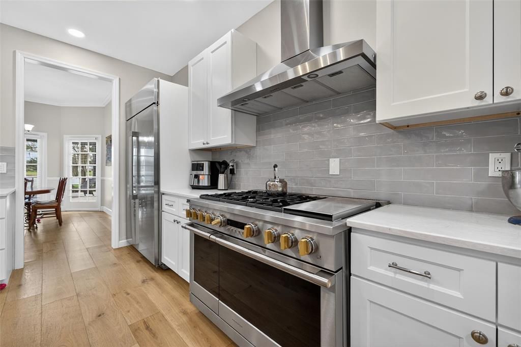 Dining room, Interior, Kitchen, Recessed Lighting, Stainless Steel Appliances, Wood Texture Flooring