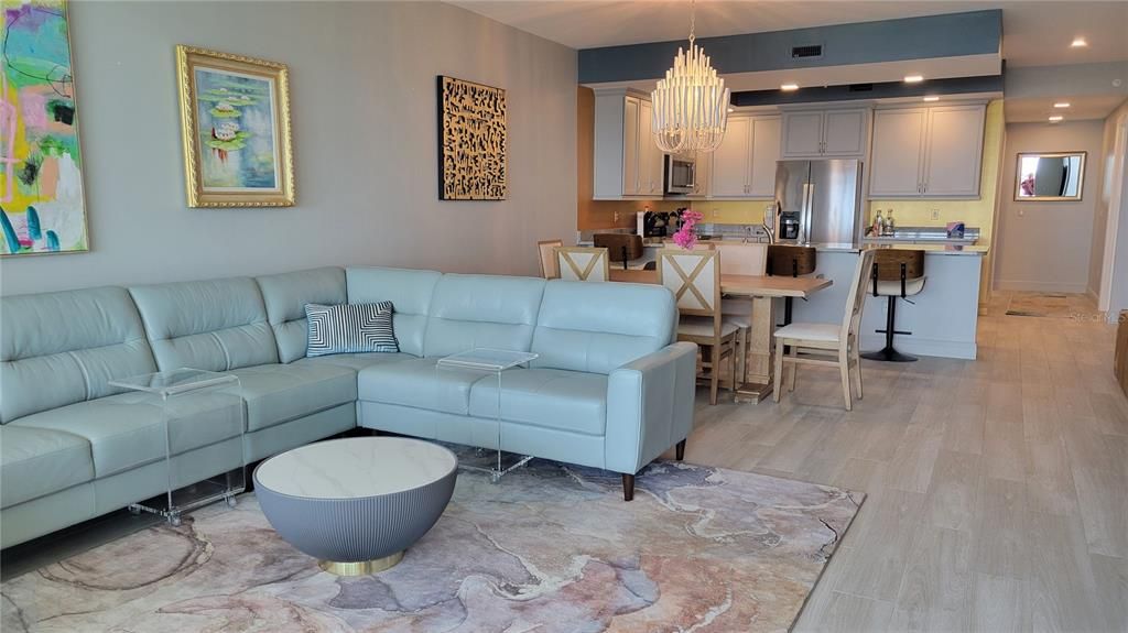 Chandelier, Dining room, Interior, Kitchen, Living room, Recessed Lighting, Stainless Steel Appliances, Wood Texture Flooring