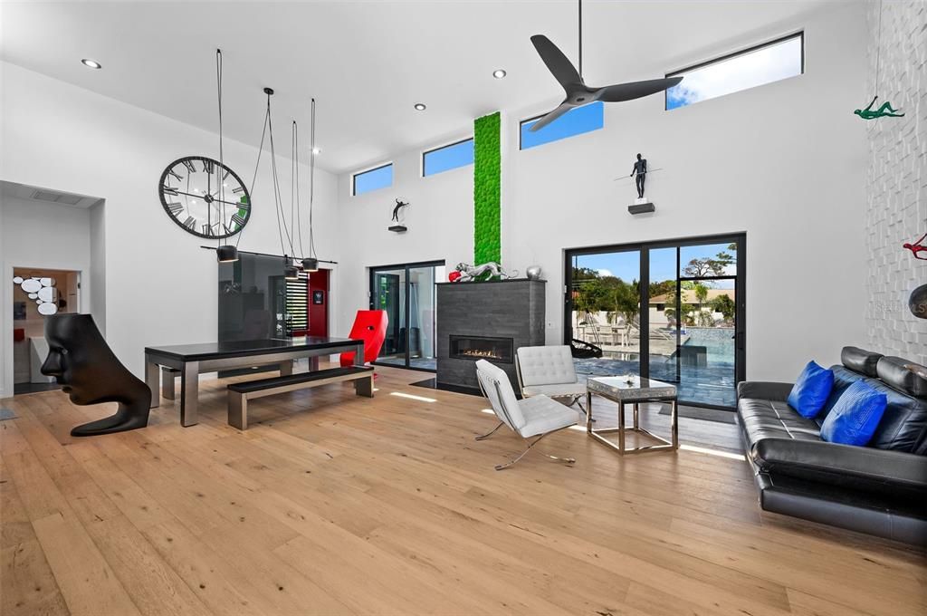 Dining room, Fireplace, Interior, Living room, Pendant Lights, Recessed Lighting, Wood Texture Flooring