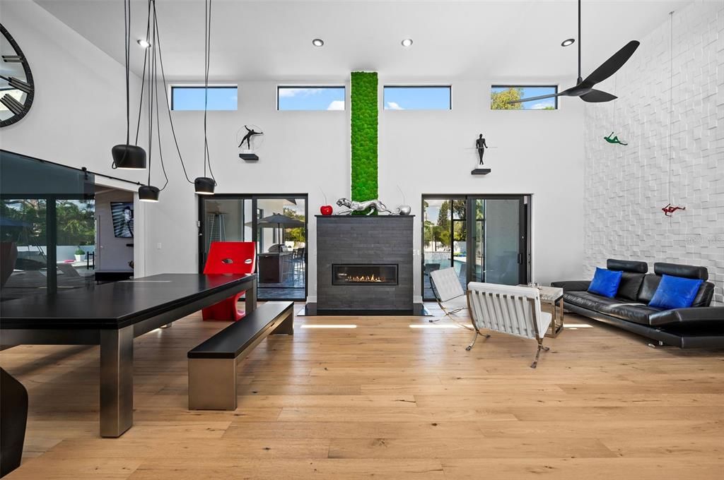 Dining room, Fireplace, Interior, Living room, Pendant Lights, Recessed Lighting, Wood Texture Flooring