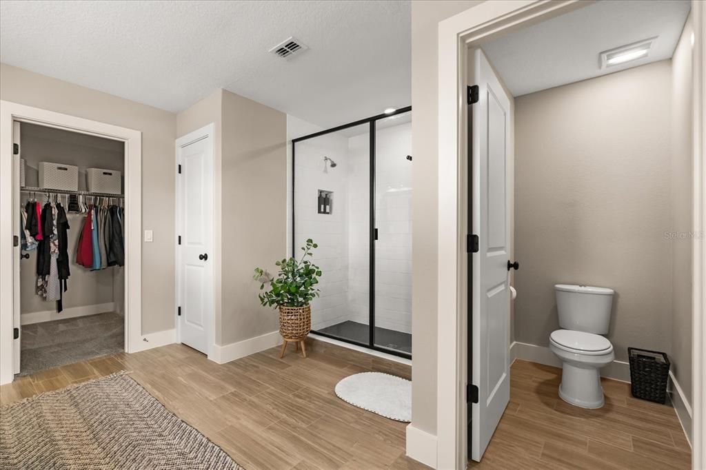Bathroom, Glass Shower, Interior, Recessed Lighting, Walk-in Closets, Wood Texture Flooring