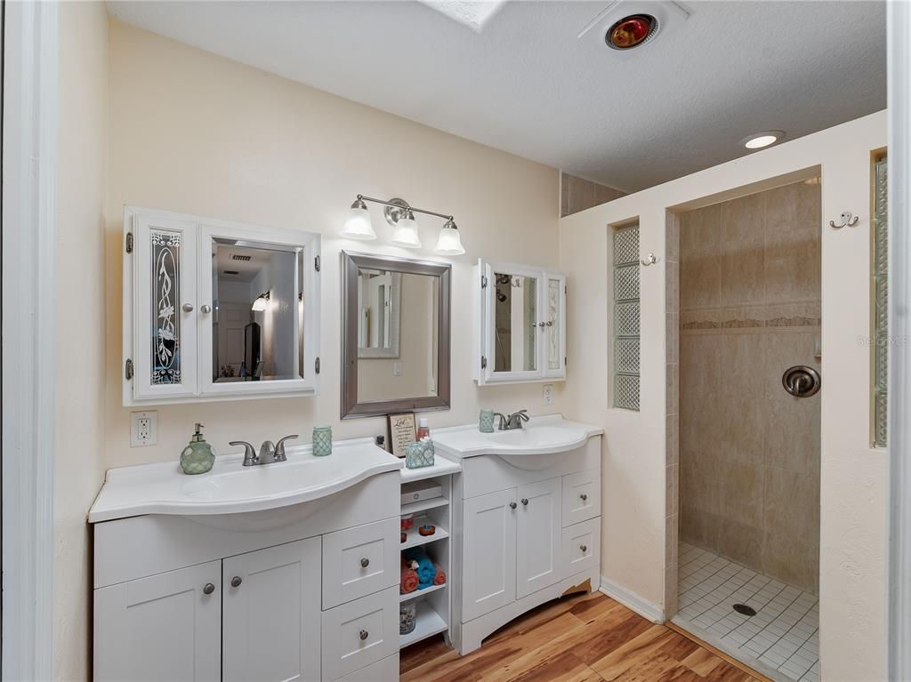Bathroom, Dual Sink Vanities, Glass Shower, Interior, Recessed Lighting, Wood Texture Flooring