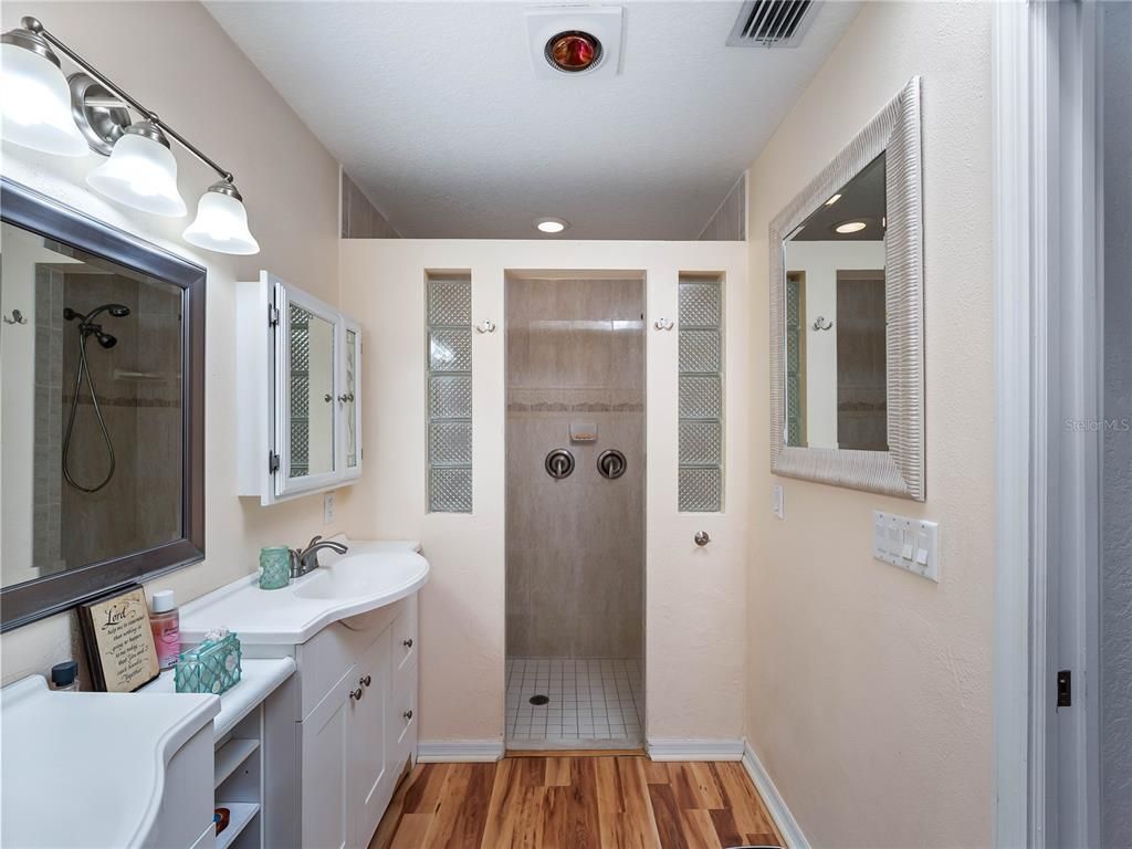 Bathroom, Dual Sink Vanities, Glass Shower, Interior, Recessed Lighting, Wood Texture Flooring