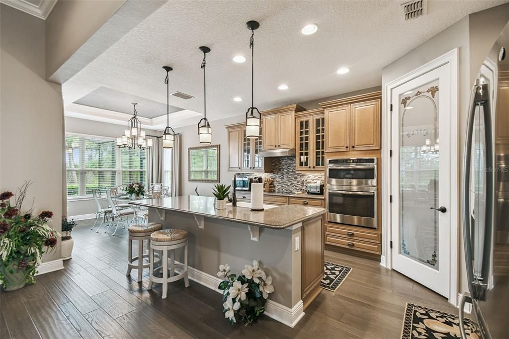 Chandelier, Dining room, Interior, Kitchen, Pendant Lights, Recessed Lighting, Stainless Steel Appliances, Wood Texture Flooring