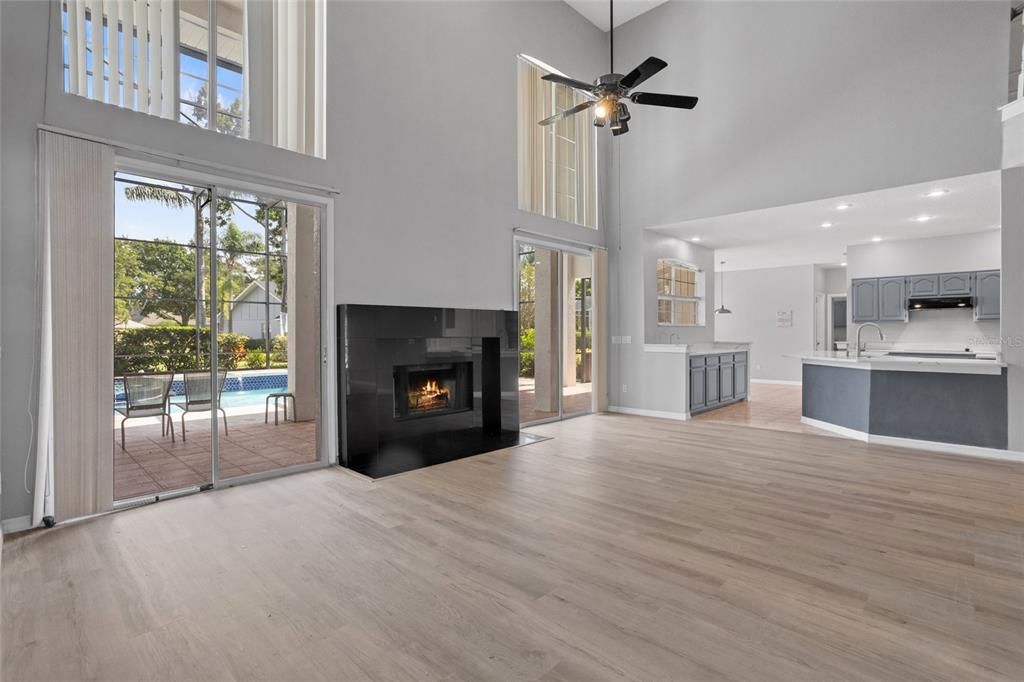 Fireplace, Interior, Kitchen, Recessed Lighting, Stainless Steel Appliances, Wood Texture Flooring