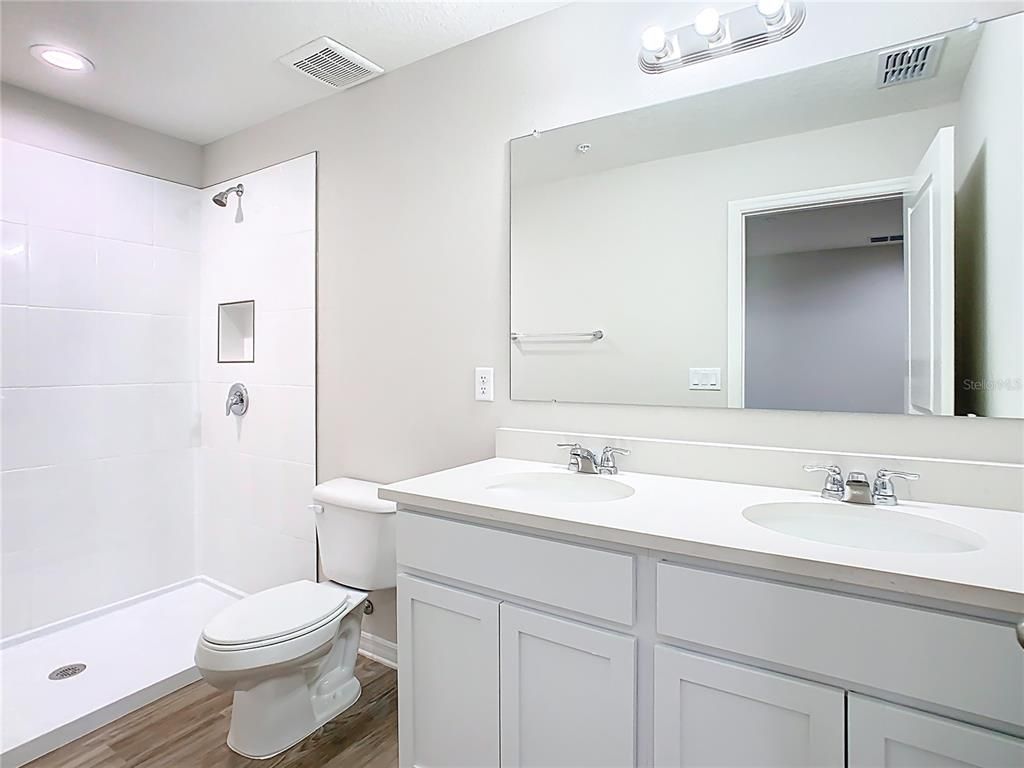 Bathroom, Dual Sink Vanities, Interior, Recessed Lighting, Wood Texture Flooring