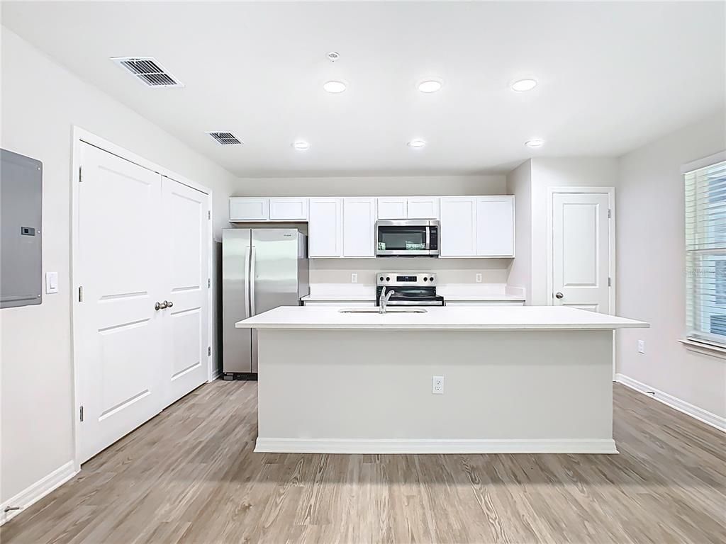 Interior, Kitchen, Recessed Lighting, Stainless Steel Appliances, Wood Texture Flooring