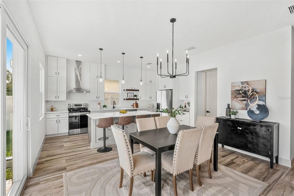 Dining room, Interior, Kitchen, Pendant Lights, Recessed Lighting, Stainless Steel Appliances, Wood Texture Flooring