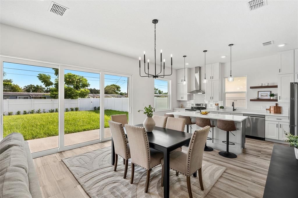 Dining room, Interior, Kitchen, Pendant Lights, Recessed Lighting, Stainless Steel Appliances, Wood Texture Flooring