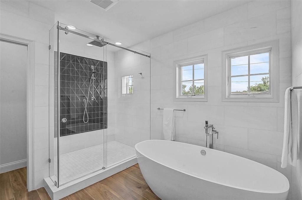 Bathroom, Free Standing Baths, Glass Shower, Interior, Recessed Lighting, Wood Texture Flooring