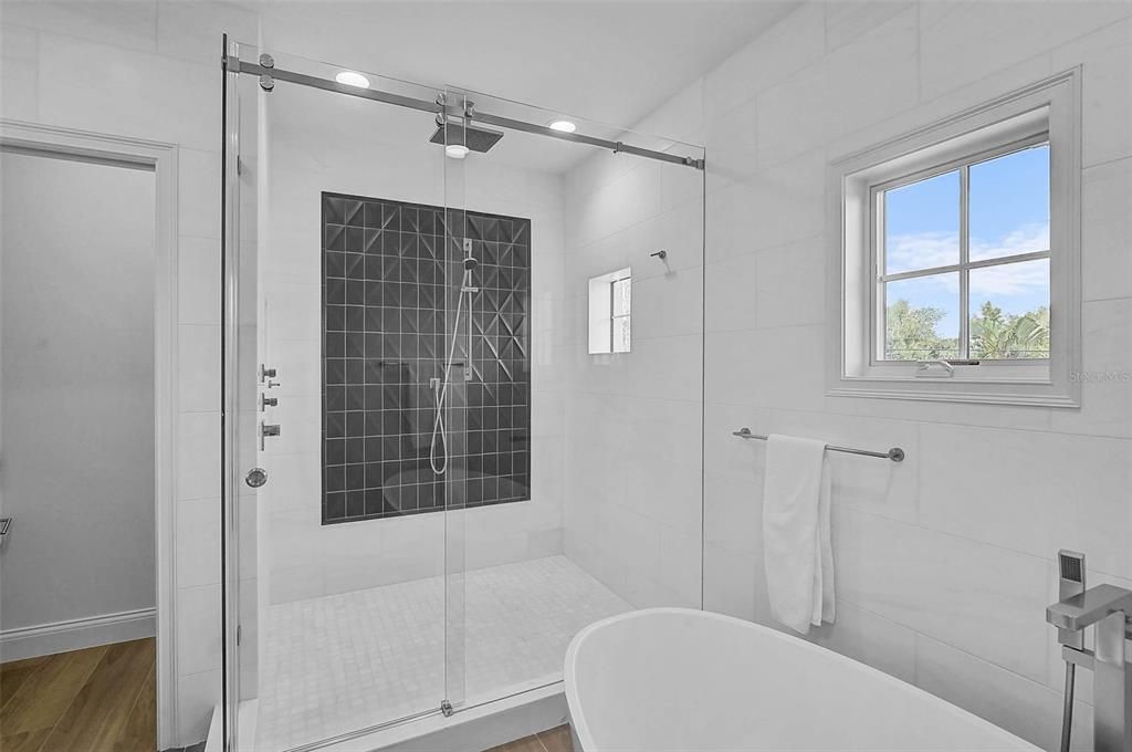 Bathroom, Free Standing Baths, Glass Shower, Interior, Recessed Lighting, Wood Texture Flooring