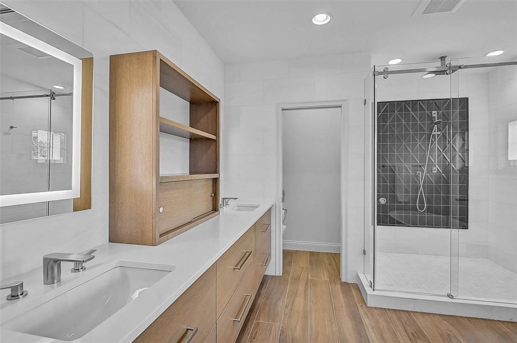 Bathroom, Dual Sink Vanities, Glass Shower, Interior, Recessed Lighting, Wood Texture Flooring