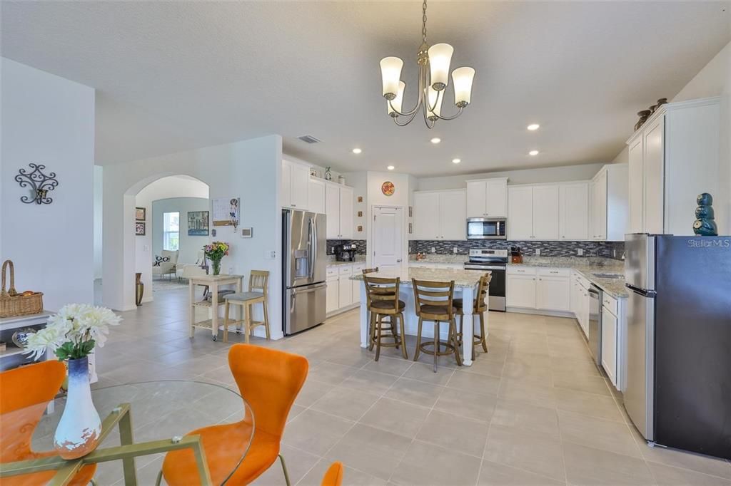 Chandelier, Dining room, Interior, Kitchen, Pendant Lights, Recessed Lighting, Stainless Steel Appliances