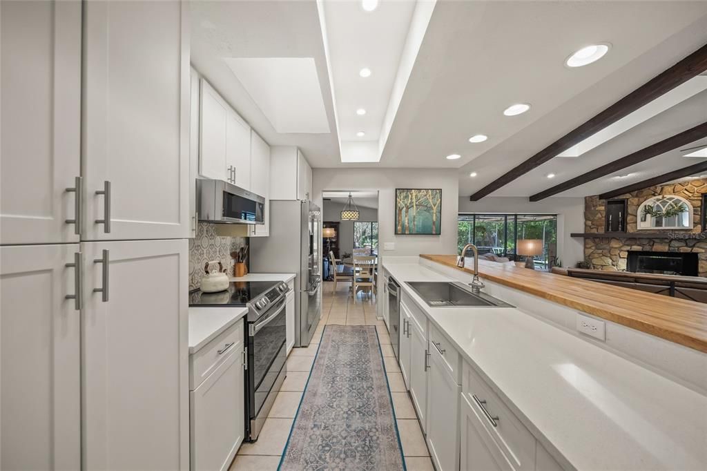 Dining room, Fireplace, Interior, Kitchen, Pendant Lights, Recessed Lighting, Stone Walls, Wooden Beams