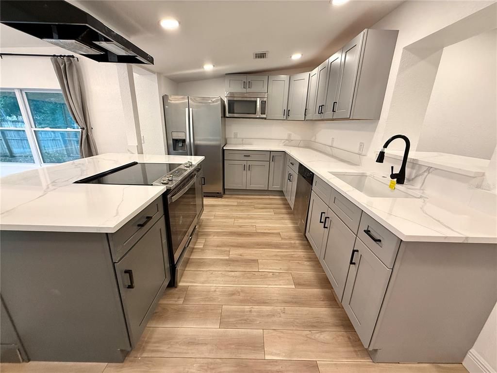 Interior, Kitchen, Recessed Lighting, Stainless Steel Appliances, Wood Texture Flooring