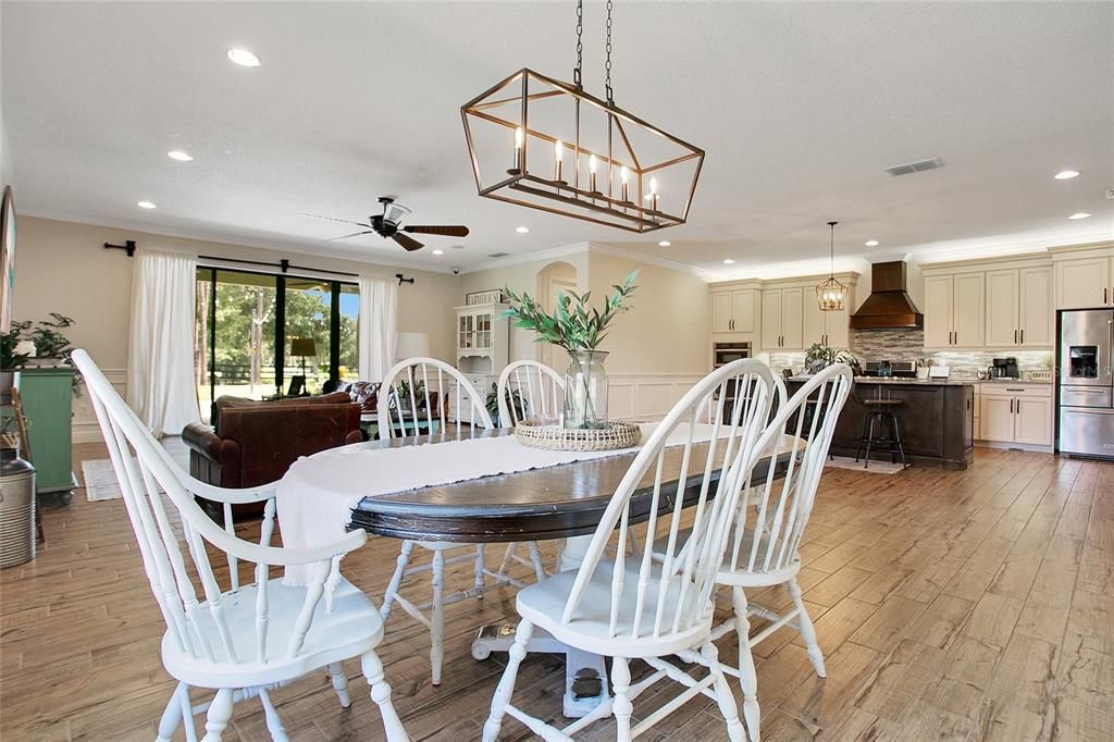 Dining room, Interior, Kitchen, Pendant Lights, Recessed Lighting, Stainless Steel Appliances, Wood Texture Flooring