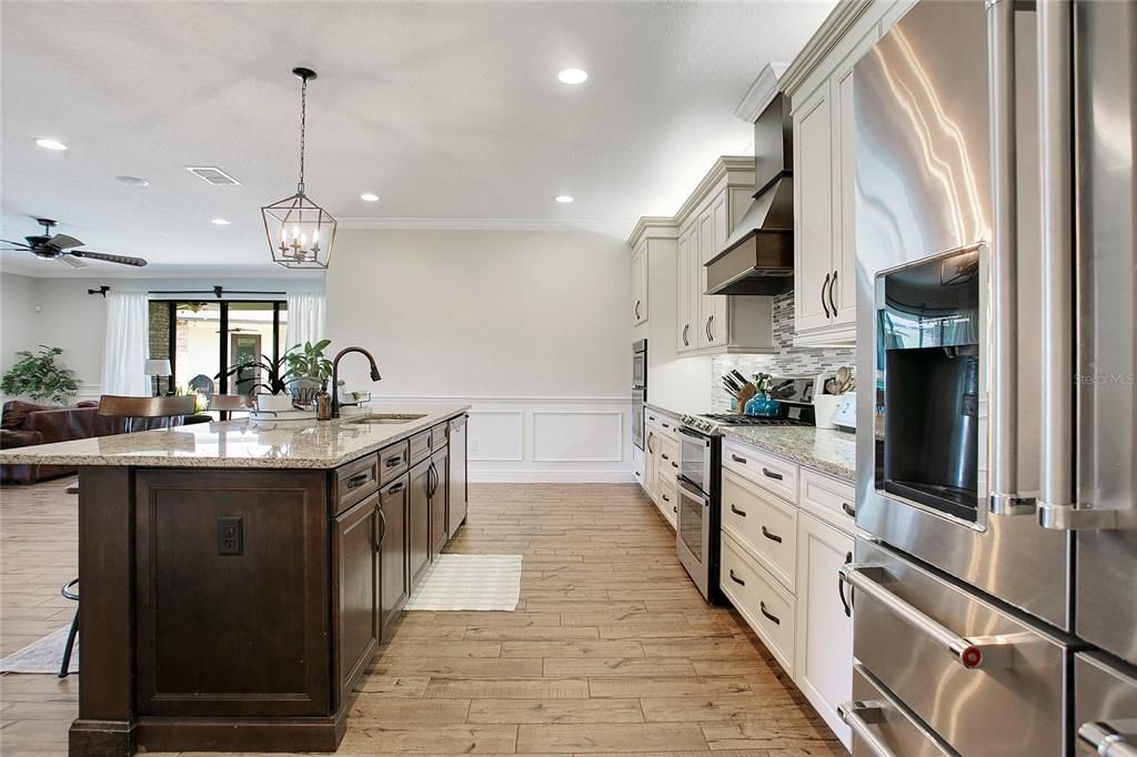 Chandelier, Interior, Kitchen, Pendant Lights, Recessed Lighting, Stainless Steel Appliances, Wood Texture Flooring