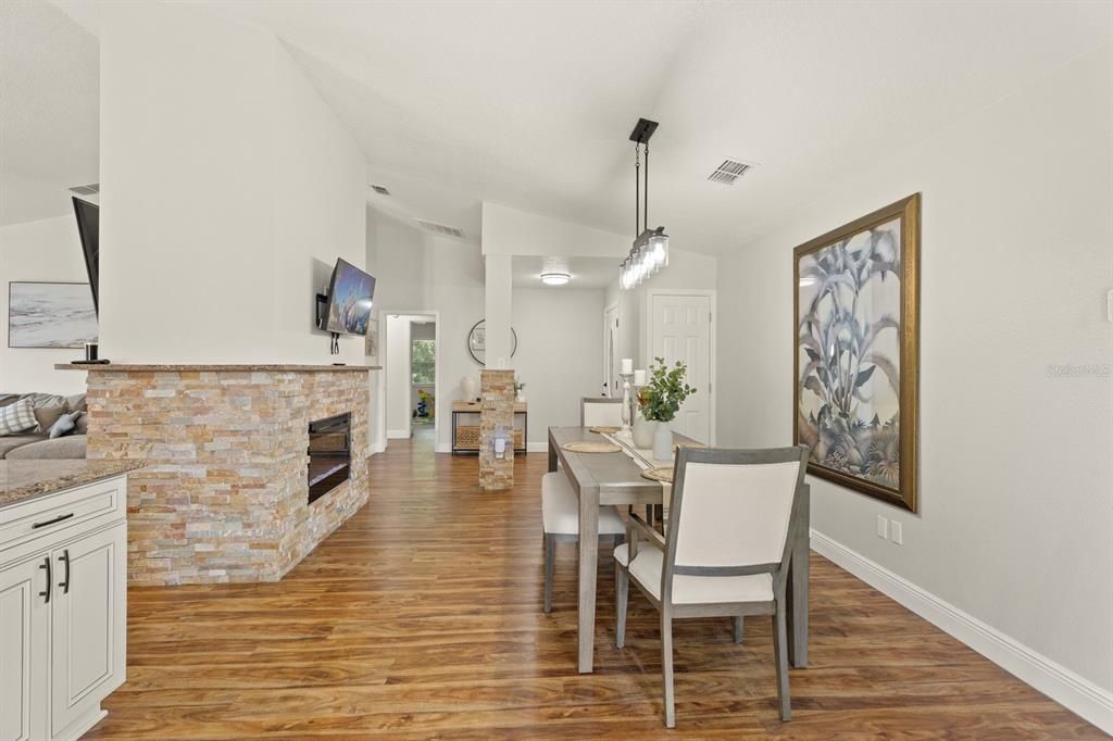 Dining room, Fireplace, Interior, Pendant Lights, Wood Texture Flooring