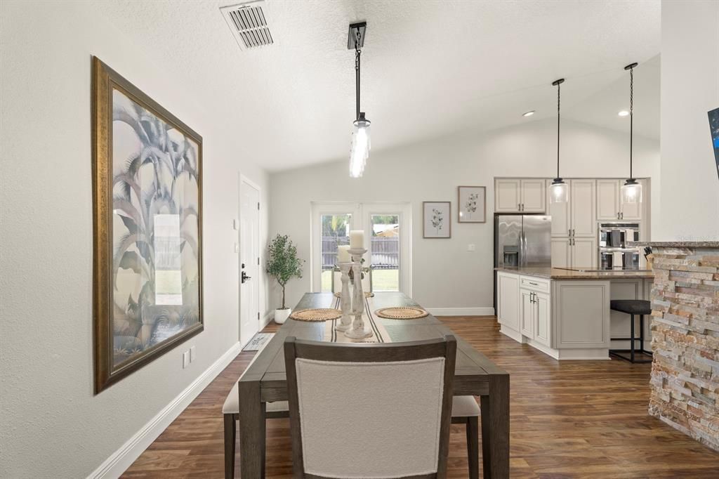 Dining room, Interior, Kitchen, Pendant Lights, Recessed Lighting, Stainless Steel Appliances, Wood Texture Flooring