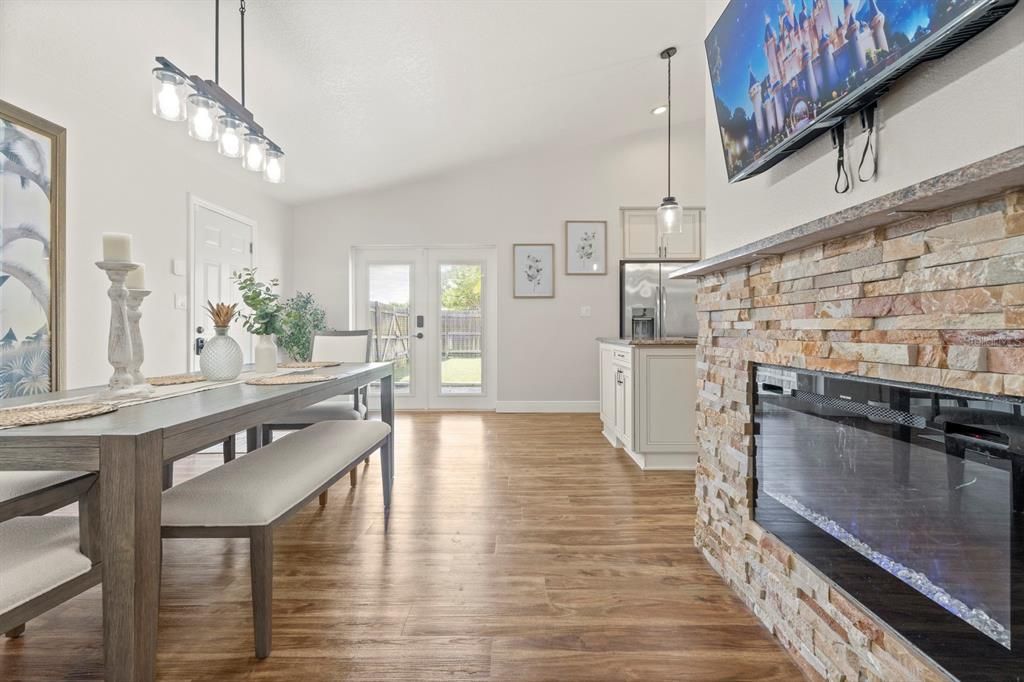 Dining room, Fireplace, Interior, Kitchen, Pendant Lights, Stone Walls, Wood Texture Flooring