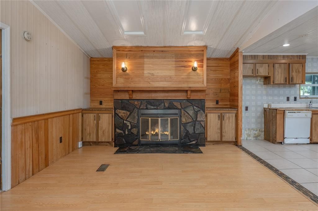 Fireplace, Interior, Kitchen, Recessed Lighting, Wood Texture Flooring, Wooden Walls