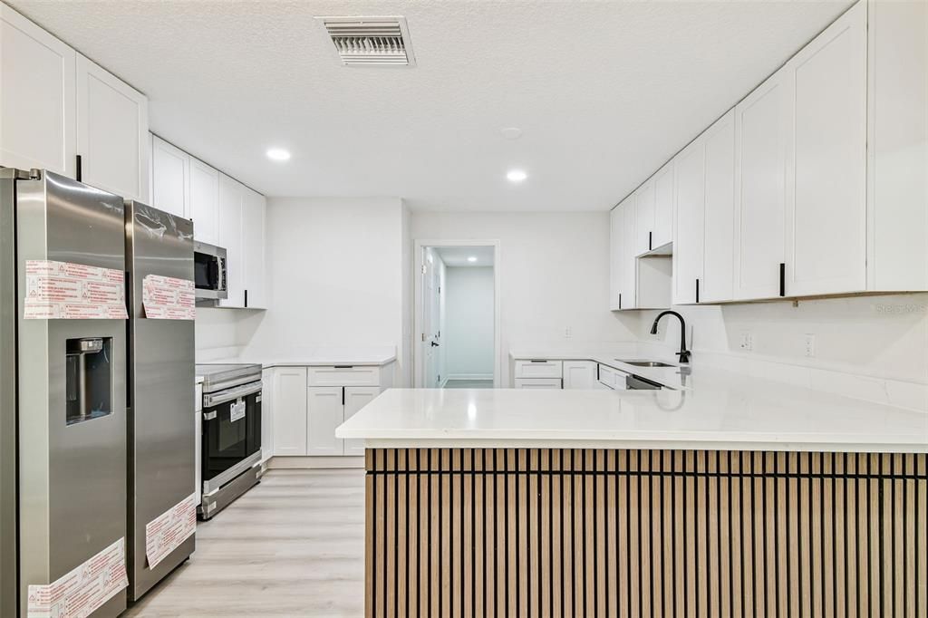 Interior, Kitchen, Recessed Lighting, Stainless Steel Appliances, Wood Texture Flooring
