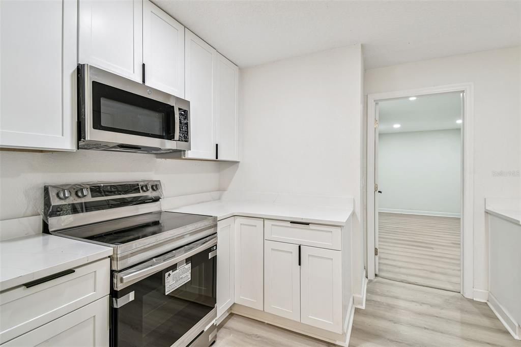 Interior, Kitchen, Recessed Lighting, Stainless Steel Appliances, Wood Texture Flooring