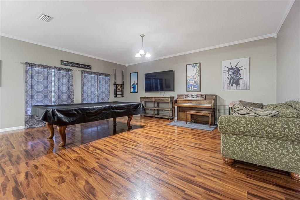 Billiard Table, Game Room, Interior, Pendant Lights, Piano, Wood Texture Flooring