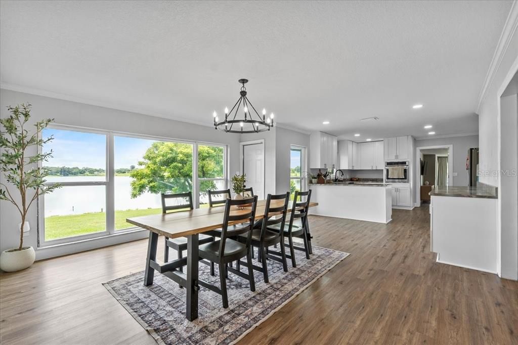 Chandelier, Dining room, Interior, Kitchen, Pendant Lights, Recessed Lighting, Stainless Steel Appliances, Wood Texture Flooring