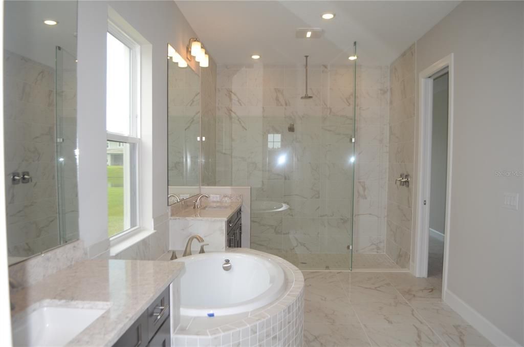 Bathroom, Dual Sink Vanities, Glass Shower, Interior, Marble, Marble Walls, Recessed Lighting