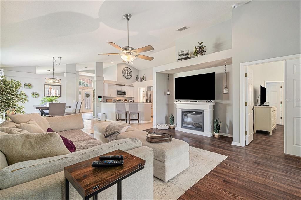 Dining room, Fireplace, Interior, Kitchen, Living room, Pendant Lights, Stainless Steel Appliances, Wood Texture Flooring