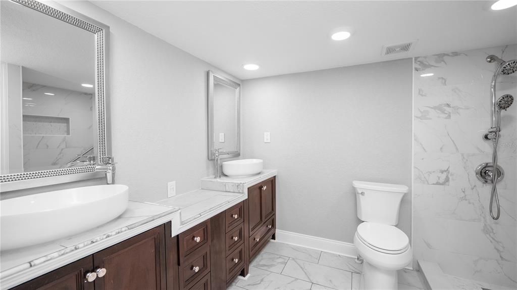 Bathroom, Dual Sink Vanities, Interior, Marble, Marble Walls, Recessed Lighting