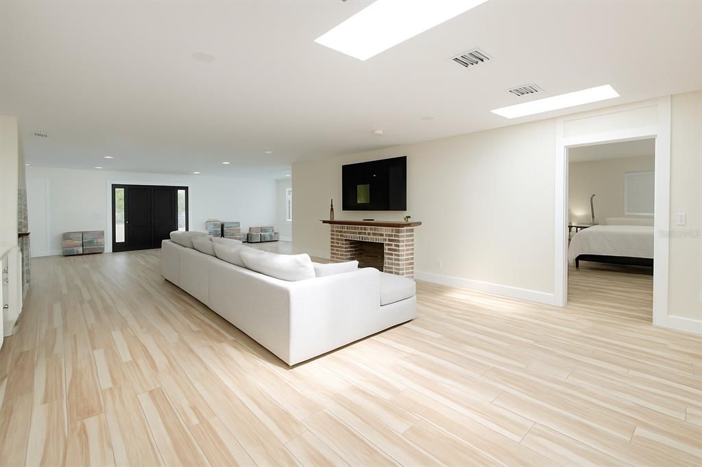 Fireplace, Interior, Living room, Recessed Lighting, Wood Texture Flooring