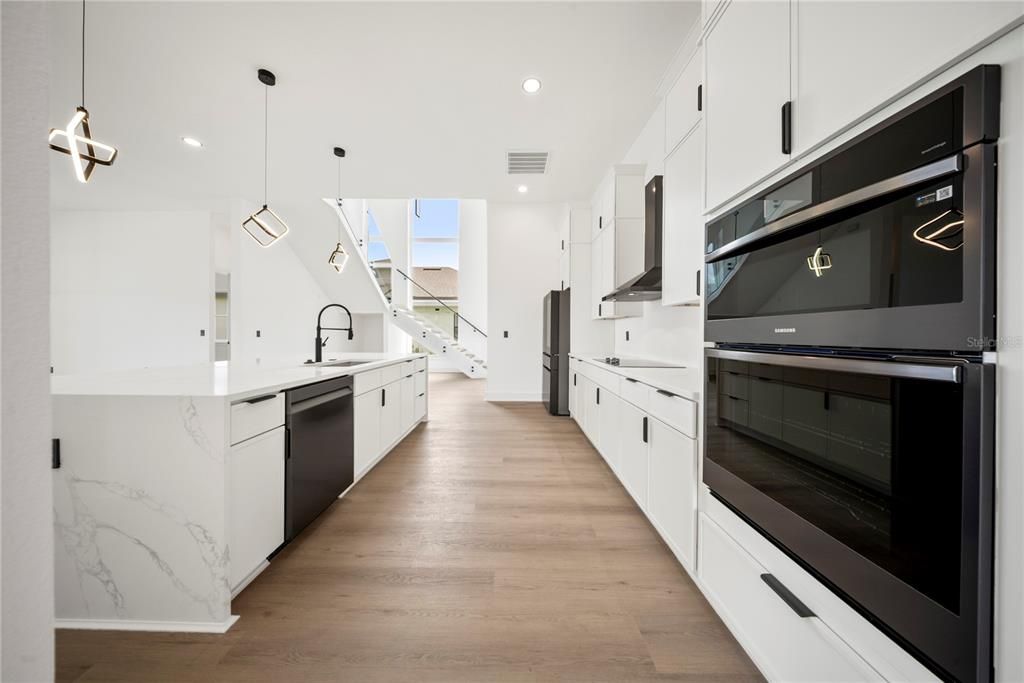 Interior, Kitchen, Pendant Lights, Recessed Lighting, Stainless Steel Appliances, Wood Texture Flooring