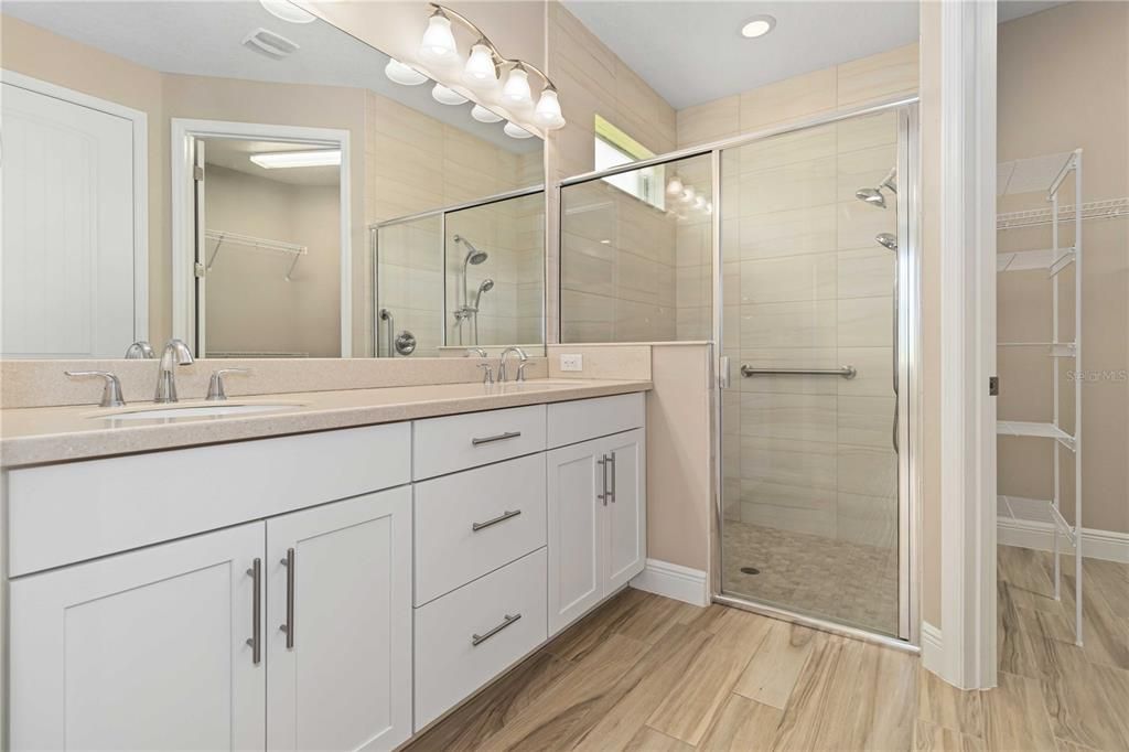 Bathroom, Dual Sink Vanities, Glass Shower, Interior, Recessed Lighting, Wood Texture Flooring