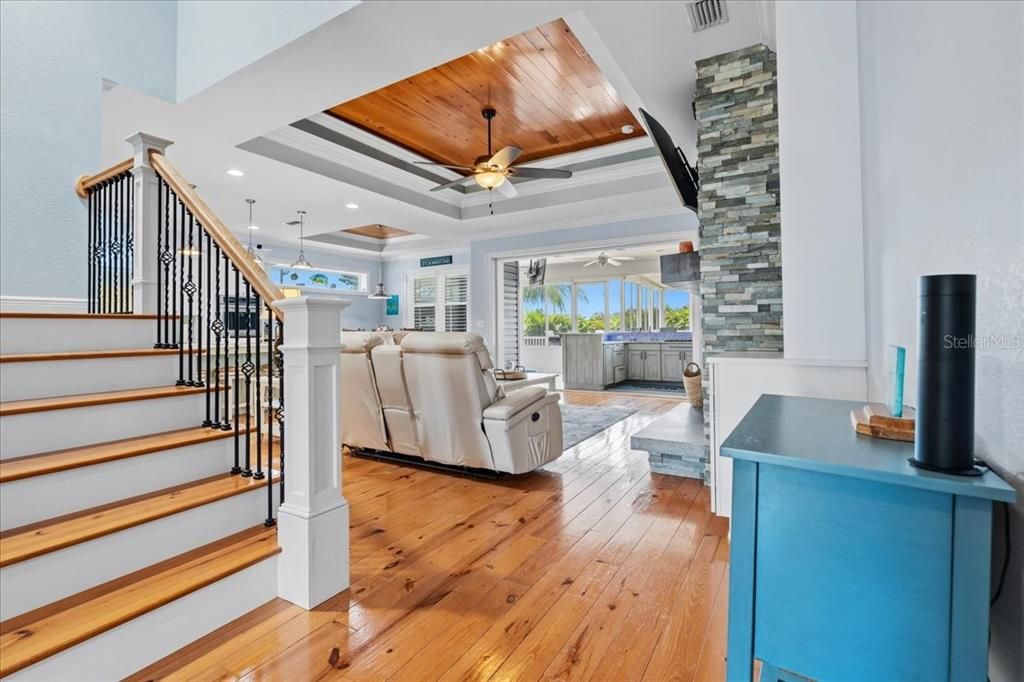 Fireplace, Interior, Living room, Pendant Lights, Recessed Lighting, Stone Walls, Wood Texture Flooring