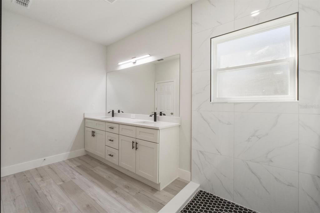 Bathroom, Dual Sink Vanities, Interior, Marble Walls, Wood Texture Flooring
