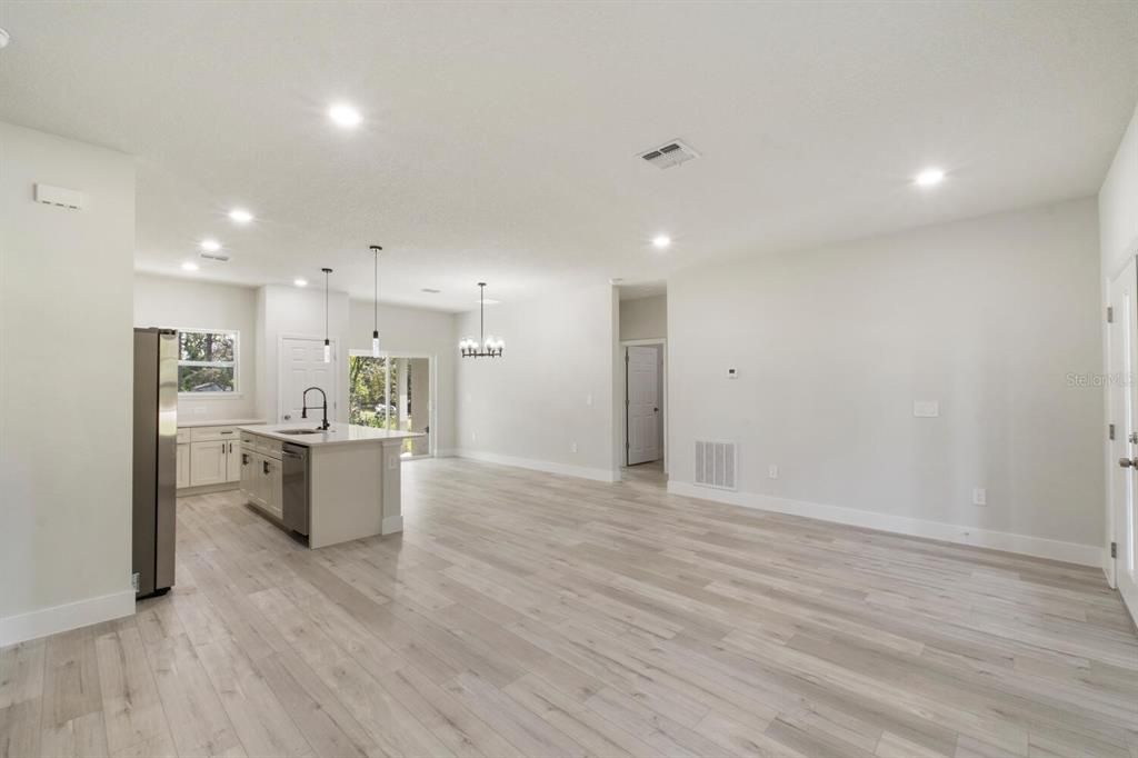 Chandelier, Empty room, Interior, Kitchen, Pendant Lights, Recessed Lighting, Wood Texture Flooring