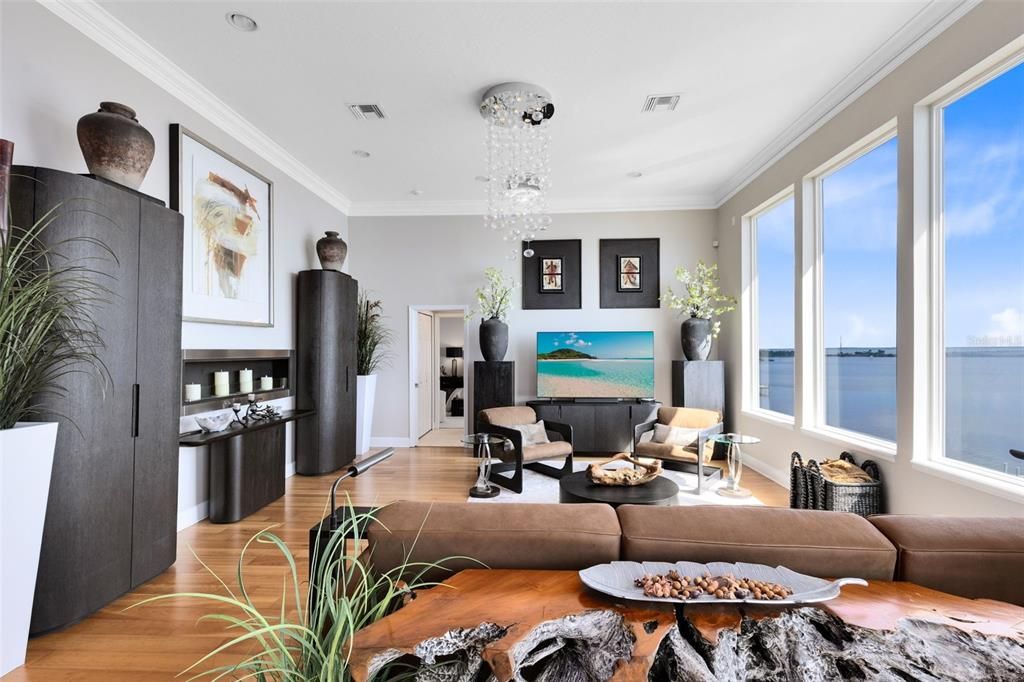 Chandelier, Fireplace, Interior, Living room, Recessed Lighting, Water, Wood Texture Flooring