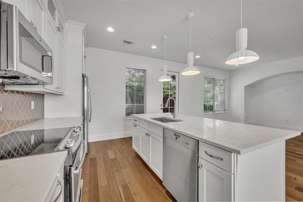 Interior, Kitchen, Pendant Lights, Recessed Lighting, Stainless Steel Appliances, Wood Texture Flooring