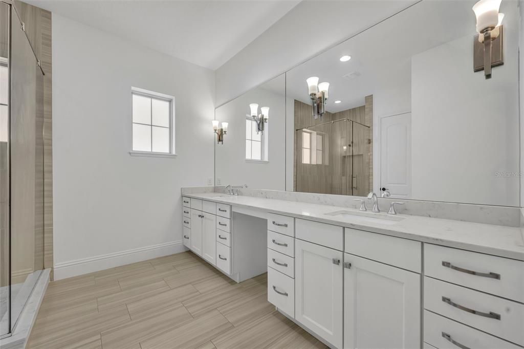 Bathroom, Dual Sink Vanities, Glass Shower, Interior, Recessed Lighting, Wood Texture Flooring