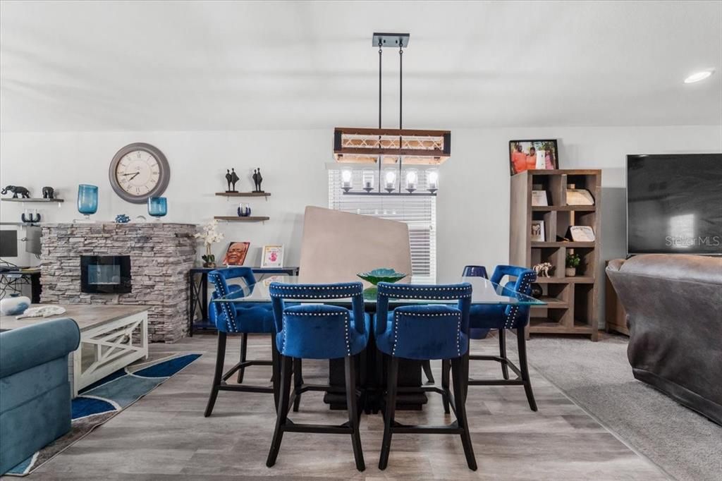 Dining room, Fireplace, Interior, Pendant Lights, Recessed Lighting, Wood Texture Flooring