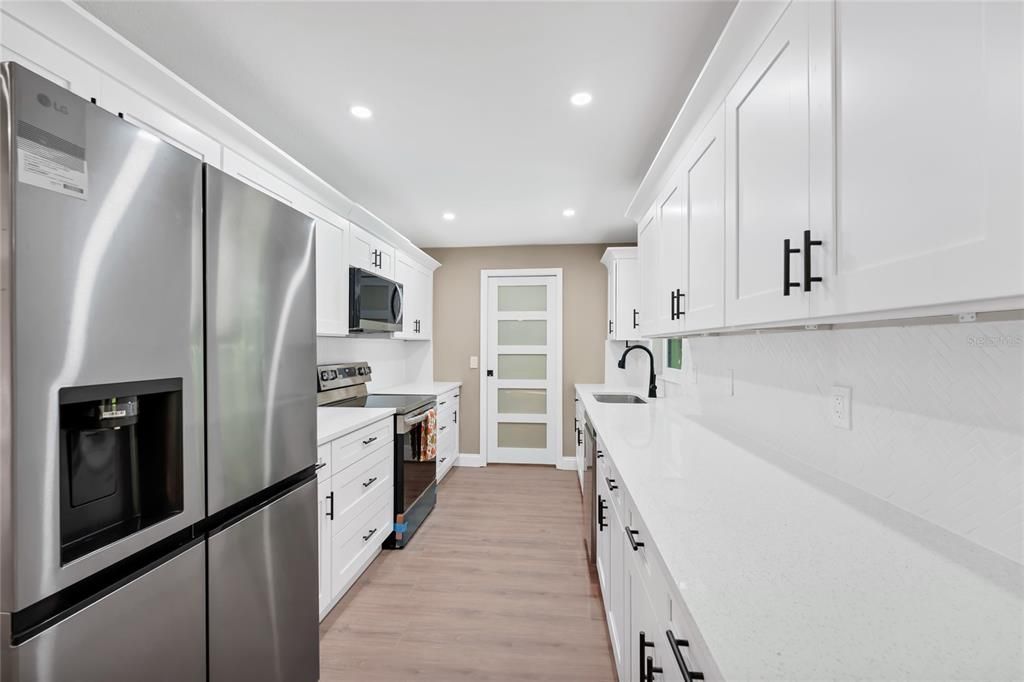 Interior, Kitchen, Recessed Lighting, Stainless Steel Appliances, Wood Texture Flooring