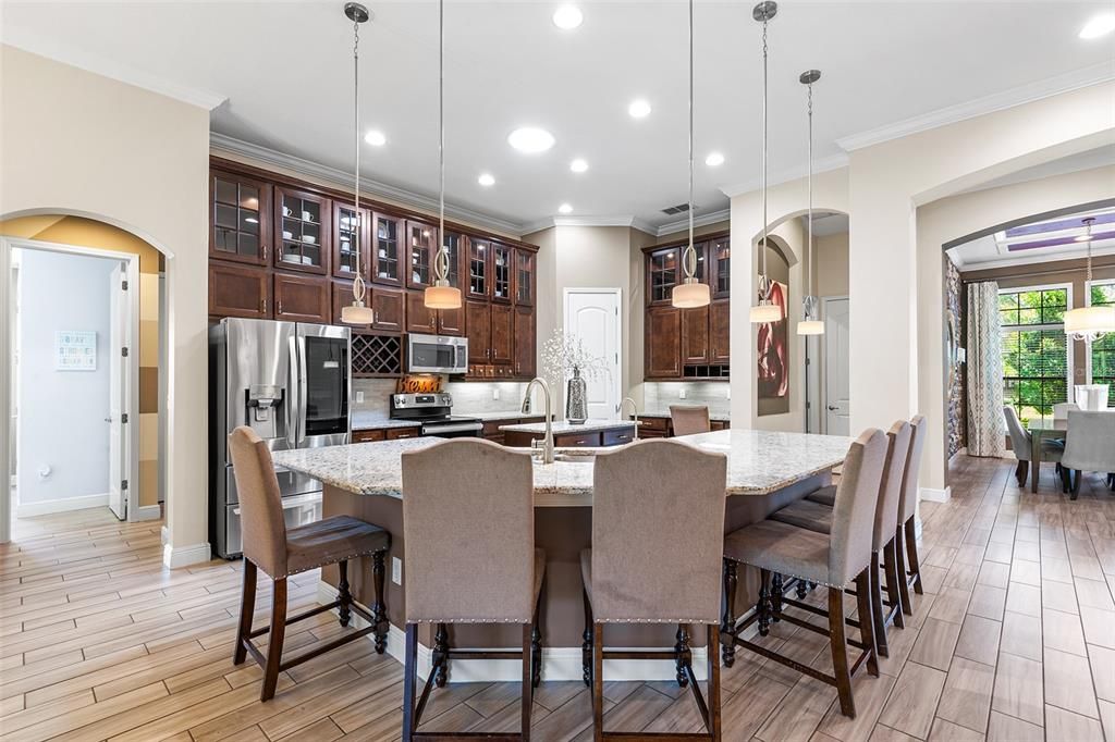 Dining room, Interior, Kitchen, Pendant Lights, Recessed Lighting, Stainless Steel Appliances, Wood Texture Flooring